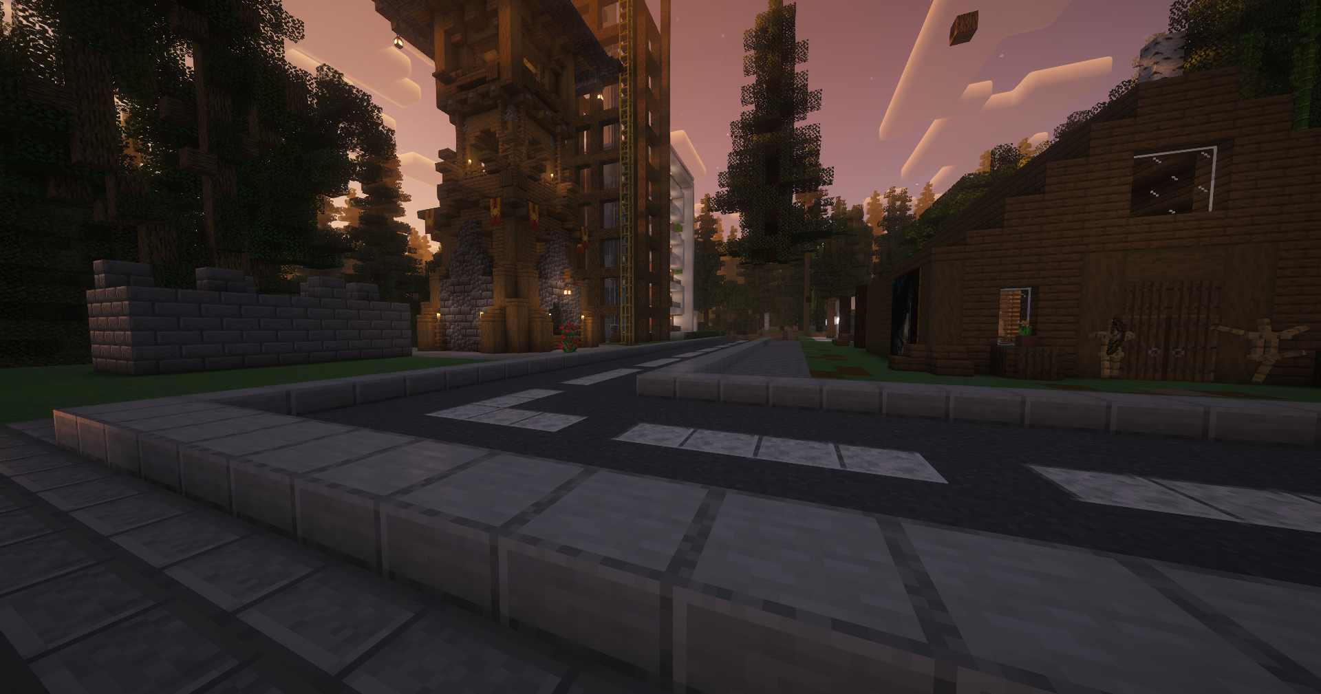 A street in Asama lined with buildings and forest.